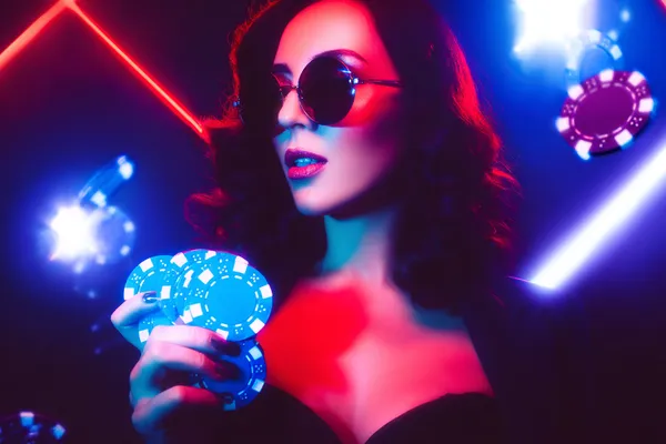 A player using their smartphone during a festive local event, representing 88FD’s fully mobile-friendly casino.