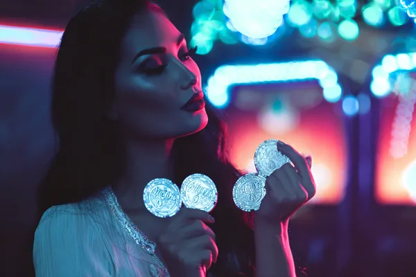 88FD Member Login — Return to your personalized dashboard A person using their device against a moody casino-themed background, illustrating the smooth re-entry process at 88FD.